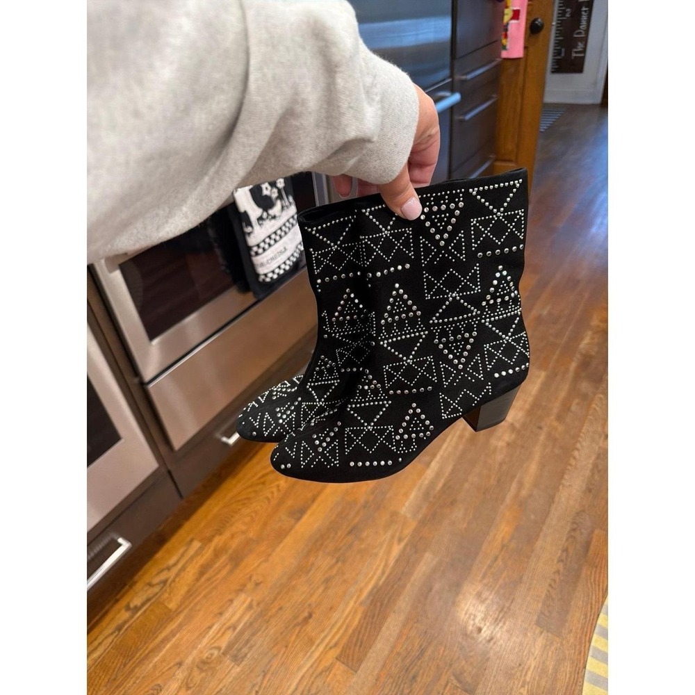 Rebecca Minkoff Hessania booties featuring black suede with a geometric silver 6